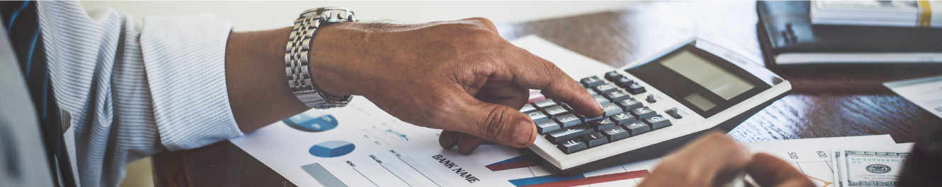 Man using calculator 